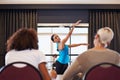 Let your body move to the music. a female dancer performing before the judges during a dance audition.