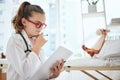 Let your imagination run wild. a little girl pretending to be a doctor while examining her stuffed animal at home. Royalty Free Stock Photo