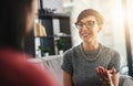 Let your voice be a positive one of encouragement. businesswomen having a conversation in the office. Royalty Free Stock Photo