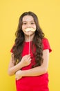 Lets be funny. party elements. happy childhood. small kid yellow background. cheerful child with beautiful long hair Royalty Free Stock Photo