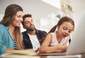 Lets chat with grandma and grandpa. a happy married couple and their young daughter using a laptop together at home. Royalty Free Stock Photo