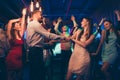 Lets dance my love. Portrait of positive cheerful couple students have wedding party dance on discotheque with lots