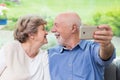 Lets do a selfie - elder coulpe Royalty Free Stock Photo