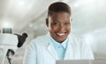 Lets find a cure. an attractive young scientist sitting alone in her laboratory.