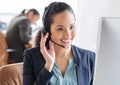 Lets find you a solution. an attractive young female call center agent working at her desk in the office.