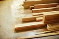 Lets get building. Still life shot of piles of wood stacked inside a carpentry workshop.