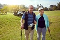 Lets get going. a smiling senior couple enjoying a day on the golf course. Royalty Free Stock Photo