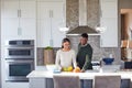 Lets get healthy, babe. a young couple preparing a healthy meal together at home. Royalty Free Stock Photo