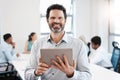 Lets get to work on those big ideas. Portrait of a confident mature businessman using a digital tablet in an office. Royalty Free Stock Photo