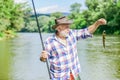 Lets go fishing. summer weekend. Big game fishing. retired bearded fisher. Trout bait. fisherman with fishing rod. hobby Royalty Free Stock Photo