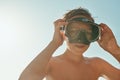 Lets go have a look at whats under the sea. a young boy enjoying a day at the beach. Royalty Free Stock Photo