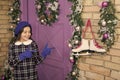 Lets go skating. Happy child point fingers at skates. Little girl with figure skates. White skates hang on wall. Ice Royalty Free Stock Photo