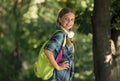 Lets go travel. Cute girl carry travel bag natural landscape. Educational trip. Tourism education. School holidays