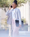 Lets have some lunch together. Shot of a young businesswoman making a phone call using her smartphone. Royalty Free Stock Photo