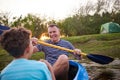 Lets head back to shore. a father and son rowing a boat together on a lake. Royalty Free Stock Photo