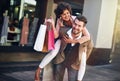 Lets head off to the next sale. a playful couple out on a shopping spree.