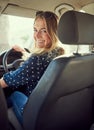 Lets hit the road. Portrait of an attractive young woman driving a car.