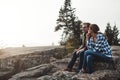 Lets just stay here and chat. a loving couple taking a break while out exploring nature.