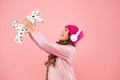 Lets play together. pink is her favorite color. small kid listen music headphones. child long curly hair. cosy winter Royalty Free Stock Photo