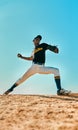 Lets see if you can hit this. a young baseball player pitching the ball during a game outdoors. Royalty Free Stock Photo