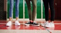 Lets show off our shoes a bit. Low angle shot of a group of unrecognizable students shoes with them standing and waiting