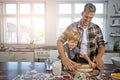 Lets show them how cooking with dad is done. a father and his son making pizza at home.