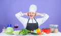 Lets start cooking. Woman chef cooking healthy food. Gourmet main dish recipes. Girl in hat and apron. Delicious recipe Royalty Free Stock Photo