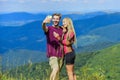 Lets take photo. Capturing beauty. Man and woman posing mobile photo. Couple taking photo. Summer vacation concept Royalty Free Stock Photo