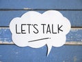 Lets Talk, text words typography written on paper against wooden background, life and business motivational inspirational