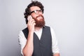 Lets talk with you, Charming and handsome bearded man in suit talking on phone with someone