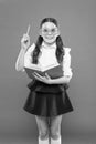 Lets write this idea. children literature. get information from book. happy school girl in uniform and party glasses