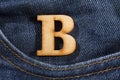 Letter B of the alphabet - blue jeans texture background. Top view Royalty Free Stock Photo