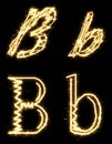 Letter B. Alphabet made by sparkler. Isolated on a black background.