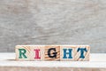 Letter block in word right on wood background