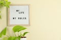 Letter board with phrase My Life My Rules and plant on beige wall. Space for text Royalty Free Stock Photo
