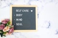 Letter board with phrase Self care, body, mind, soul with heart. Concept of mental health, mindfulness, self love. Aspiration,