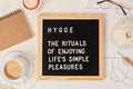 Letter board with text hygge the rituals of enjoying life simple pleasures Royalty Free Stock Photo