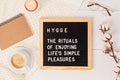 Letter board with text hygge the rituals of enjoying life simple pleasures