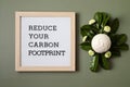 Letter board with text reduce your carbon footprint