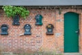 Many mailboxes at a house wall Royalty Free Stock Photo