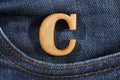 Letter C of the alphabet - blue jeans texture background. Top view Royalty Free Stock Photo