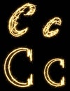 Letter C. Alphabet made by sparkler. Isolated on a black background. Royalty Free Stock Photo