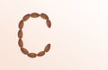 Letter C of the English alphabet from nuts. Food pattern made from nuts alphabet for shop and diet