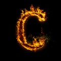 Letter C. Fire flames on black isolated background Royalty Free Stock Photo