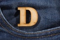 Letter D of the alphabet - blue jeans texture background. Top view Royalty Free Stock Photo