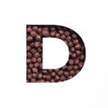 Letter D of alphabet of nutritional chocolate cereal balls, white cut paper. Typeface for healthy breakfast packaging