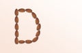 Letter D of the English alphabet from nuts. Food pattern made from nuts alphabet for shop and diet