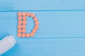 Letter d made of pills and medicine bottle. Royalty Free Stock Photo