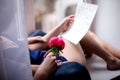 Letter Declaration of love on Valentine`s day in the hands of a girl, Flower in hand close-up Royalty Free Stock Photo