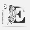 Letter E with butterfly silhouette. Monarch wing butterfly logo template isolated on white background. Calligraphic hand drawn Royalty Free Stock Photo